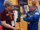 ARRL President Kay Craigie, N3KN, chats with Retired NASA Astronaut Mike Fincke, KE5AIT, at Dayton Hamvention. [Steve Ford, WB8IMY, photo]